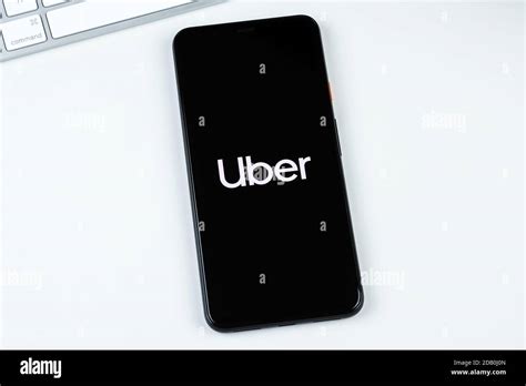 Uber app logo on a smartphone screen Stock Photo - Alamy