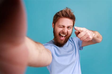 Premium Photo Portrait Of Satisfied Delighted Bearded Man Blogger