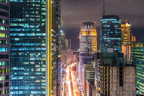 Ayala Avenue and Makati Skyline at night, during rush hour. Cityscape ...