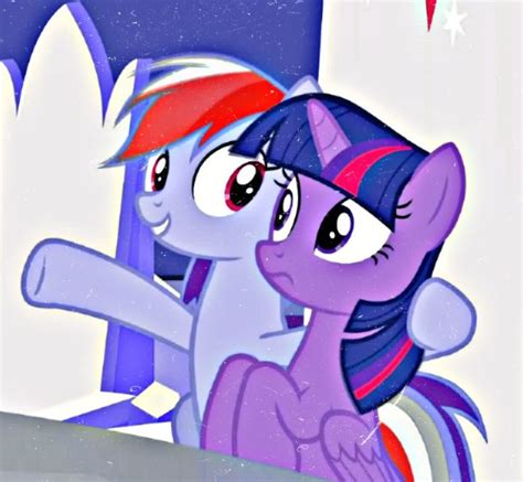 Two Ponies Standing Next To Each Other In Front Of A Wall With Stars On It