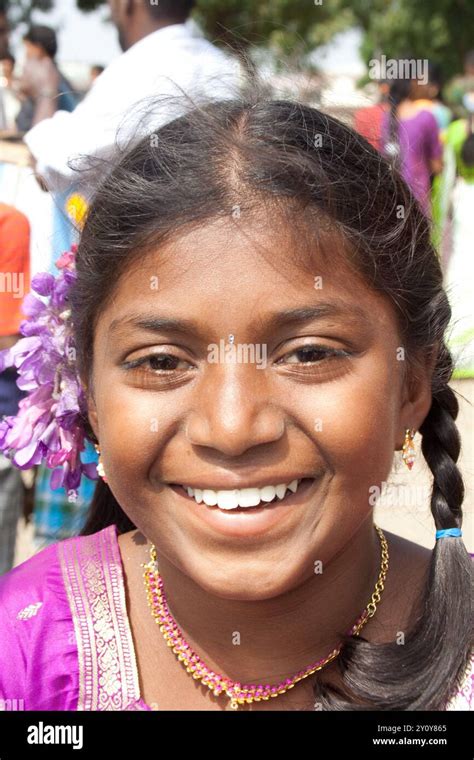 Young Girl With Wide Smile And Flowers In Her Hair Mamallapuram Tamil