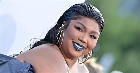 Lizzo Flaunts Curves in Swirly Swimsuit on Tropical Vacation - Parade ...