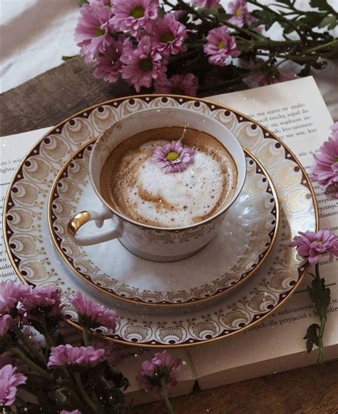 A Cup Of Cappuccino On A Saucer With Pink Flowers