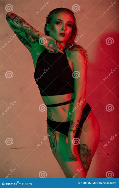 Beautiful Blonde Girl In Black Lingerie In A Pose In A Mixed Light Stock Photo Image Of Eyes