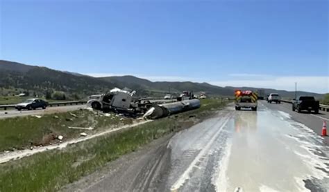 gallons  milk flood highway  tanker rollover