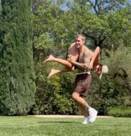 Hailey Bieber Dons Tiny Bikini As She S Thrown Over Justin S Shoulders In Cheeky Video Daily Star