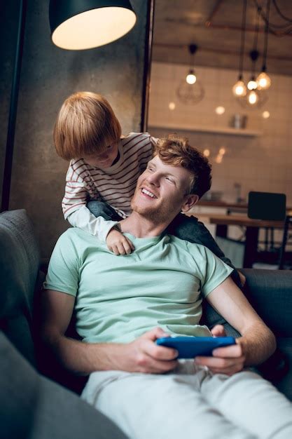 Premium Photo Pleaceful Day Dad And Son Spending Weekend Together