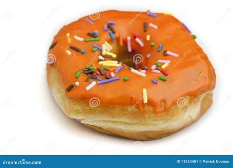 Donut with Orange Frosting and Rainbow Sprinkles Stock Image - Image of fattening, sprinkles ...