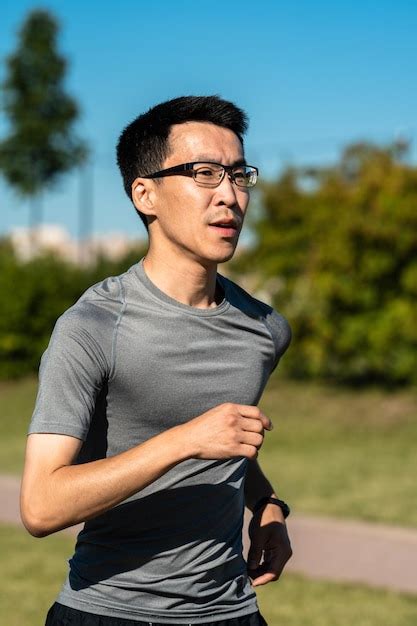 Premium Photo Close Up Portrait Of Adult Asian Man Jogging In Park