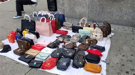 Vendors Selling Imitation Designer Bags On Canal Street In New York