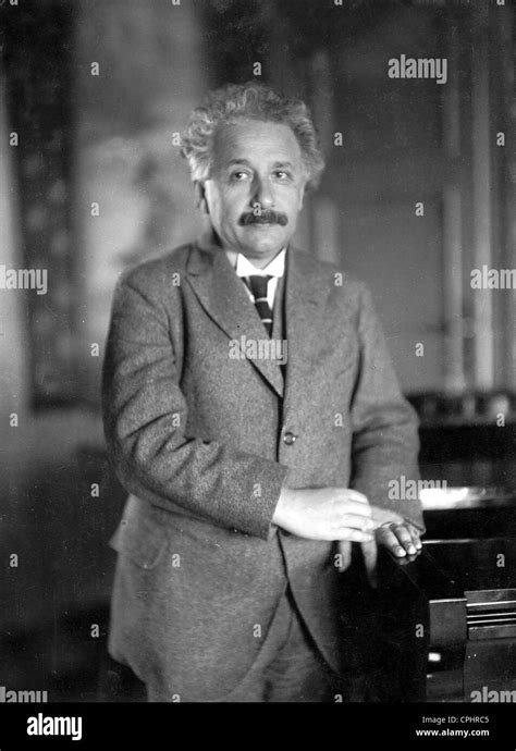 Albert Einstein Holding Nobel Prize