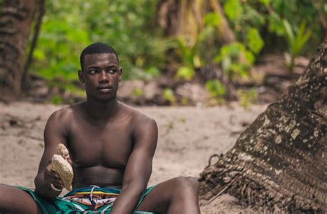 Premium Photo Black Man Holding Stones In Hand