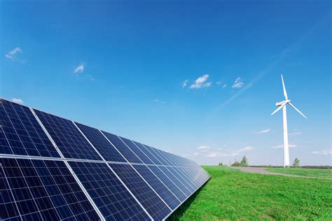 Windmill And Solar Panels On Blue Sky At Daytime Insidesources