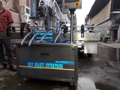 Hydraulic Automatic Four Head Volumetric Liquid Filling Machine At Rs