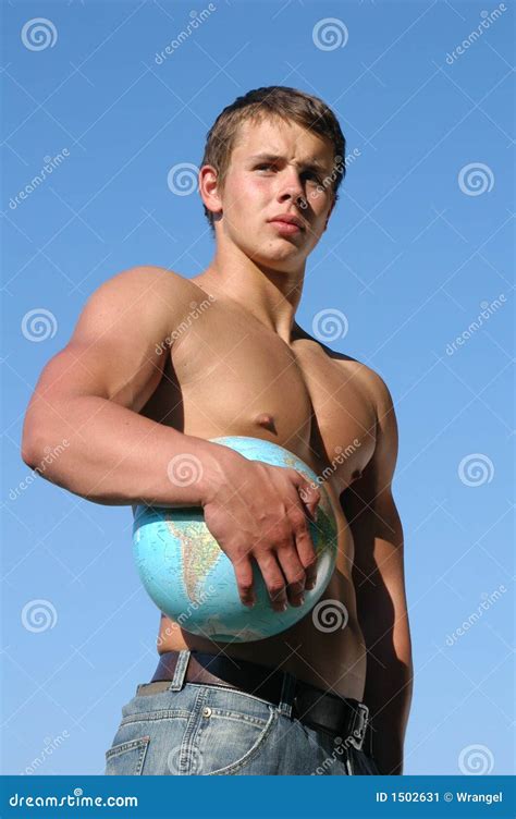 Muscular Athlete Bodybuilder Man In Black Short With A Naked Torso On A Outdoor Background Stock