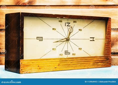 Old Rectangular Clock on the Background of Wooden Wall Stock Image - Image of ancient, elegant ...