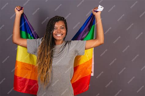 Premium Photo Young Afro Brazilian Woman Wearing Flag As A Cape Lgbt