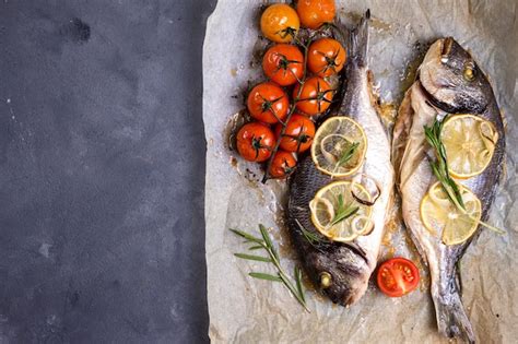 Premium Photo Tasty Baked Whole Fish On Baking Paper Baked Sea Bream