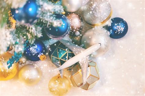 Premium Photo | Decorated christmas tree and airplane in blue sky