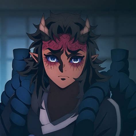 An Anime Character With Blue Eyes And Horns On His Head Is Staring At