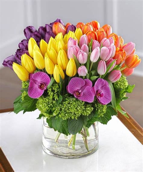 A Vase Filled With Lots Of Colorful Flowers