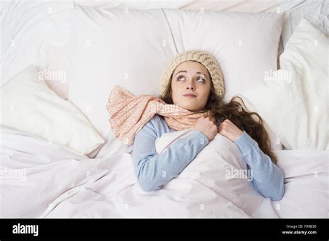 Sick Woman Lying In Bed With High Fever She Has Cold And Flu Stock