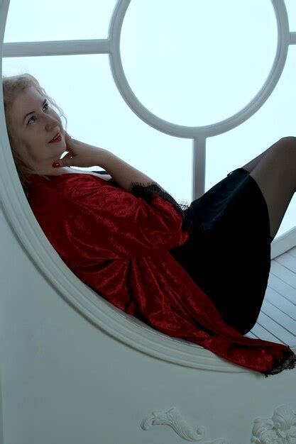 Premium Photo An Older Pretty Blonde Curly Woman