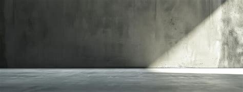 Premium Photo Sunlight Casting Sharp Shadows On A Gray Wall