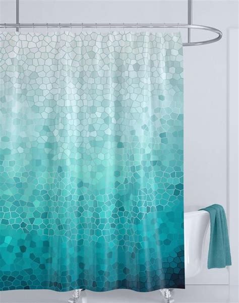 A Shower Curtain With Blue And Green Tiles On It