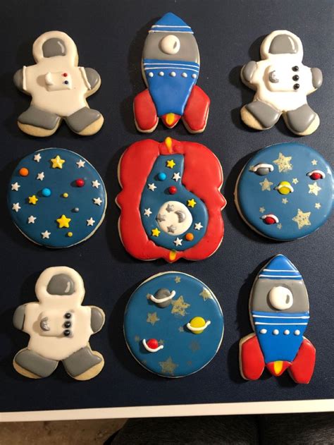 the cookies are decorated with space related items