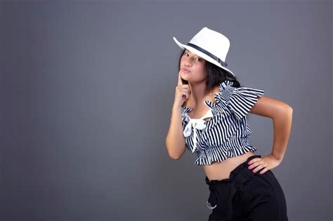 Premium Photo Young Ethnic Asian Woman Posing With White Hat Isolated