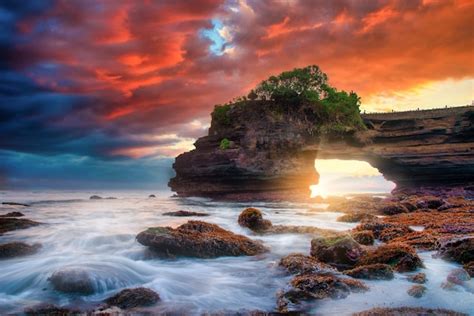 Premium Photo | Tanah Lot Temple on sea at sunset in Bali Island ...