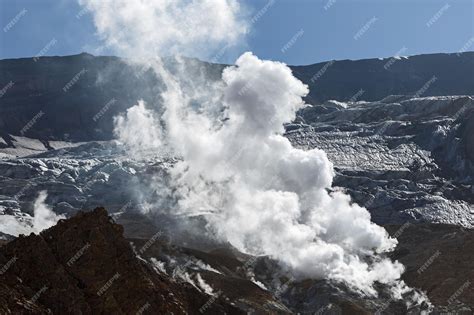 Premium Photo | Smoking fumarole in crater of active volcano volcanic ...