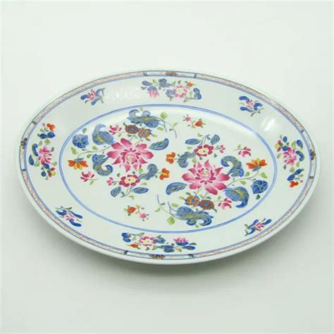 RAYNAUD ET PUIFORCAT Plat ovale en porcelaine décor de fleurs modèle