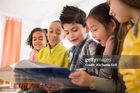 2,981 Children Sharing Books Stock Photos, High-Res Pictures, and ...