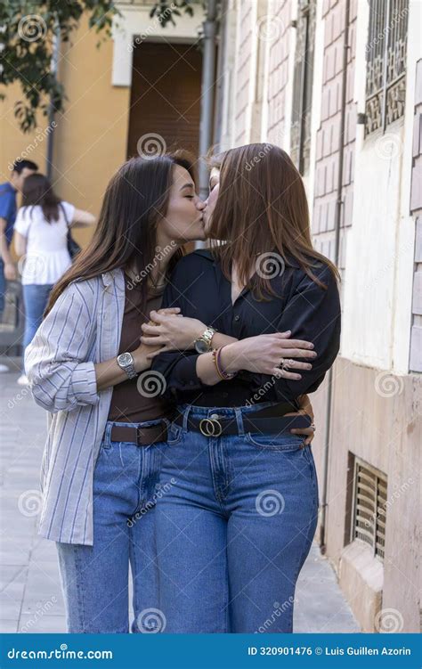 Couple Of Girls In Love Giving Each Other A Kiss Stock Photo Image Of Girls Lesbian 320901476