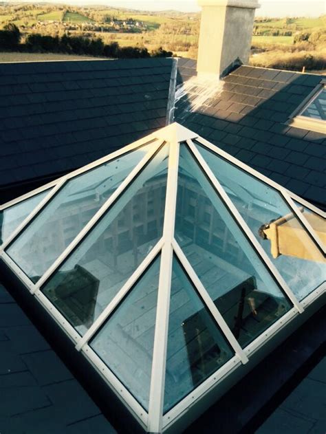 The Roof Of A House With A Skylight On It