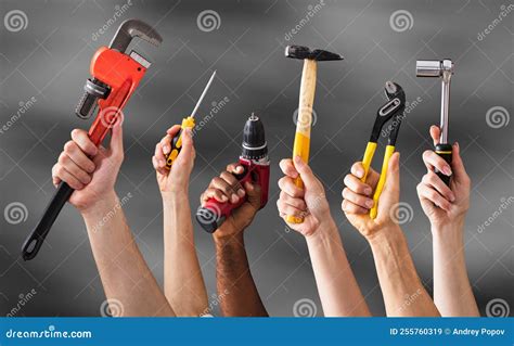 Hands Holding Work Tools Stock Image Image Of Diverse 255760319