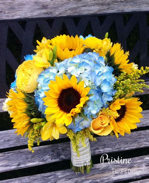 Bridal Bouquet Designed using Blue Hydrangea, Sunflowers, Freesia, Buttons, Roses, … | Sunflower ...