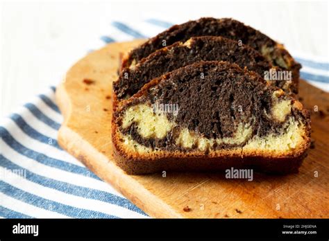 Homemade Chocolate And Vanilla Marble Cake On A Rustic Wooden Board Side View Close Up Stock