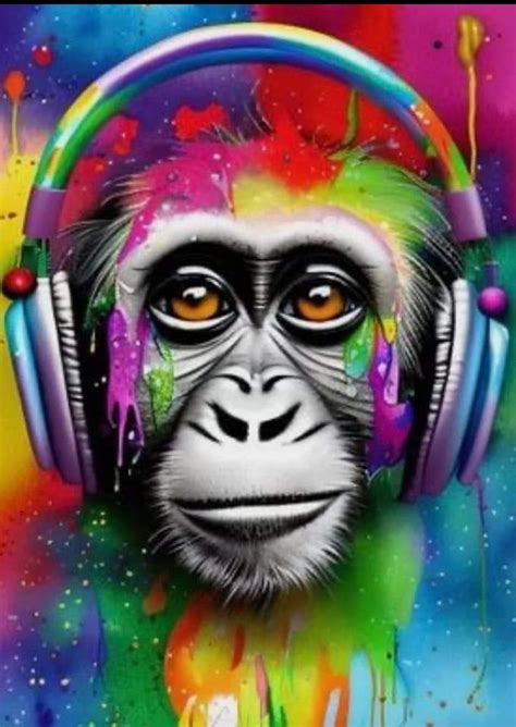 A Monkey Wearing Headphones With Colorful Paint Splattered On It S Face