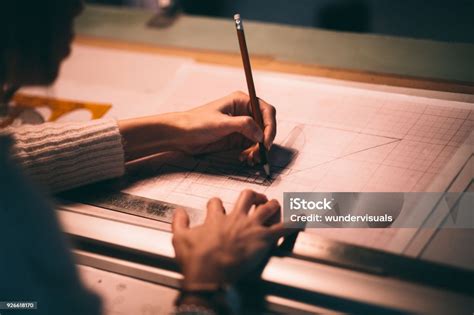 Closeup Of Woman Architect Working On Architecture Blueprints Stock