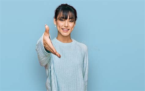 Young Hispanic Woman Wearing Casual Clothes Smiling Friendly Offering