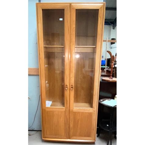 An Ercol Windsor Style Full Height Display Cabinet With 3 Glass Shelves 213cm High X 31 Deep X 92cm