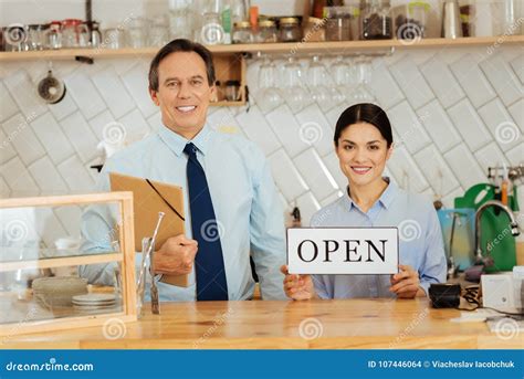 Confident Gay Boss Standing And Holding The Folder Stock Photo Image
