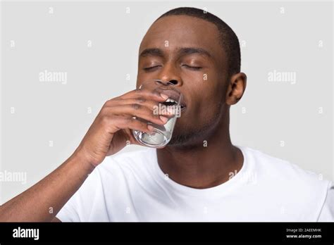 Man Drinking Glass Of Water