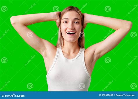 Young Woman with Blonde Hair Reacts with Surprise in Front of Green ...