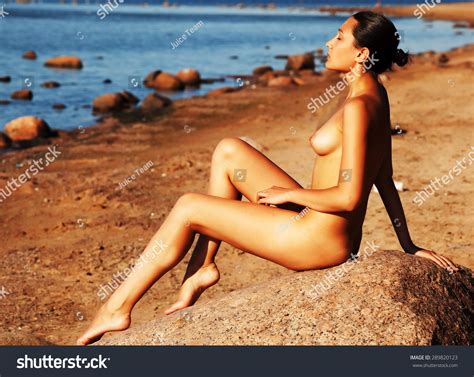 Naked Woman Sitting On Stone Beach Stock Photo Shutterstock