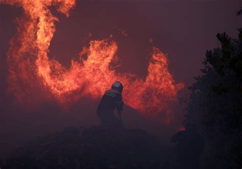 Drop in winds offers hope as Greek firefighters battle huge wildfire ...