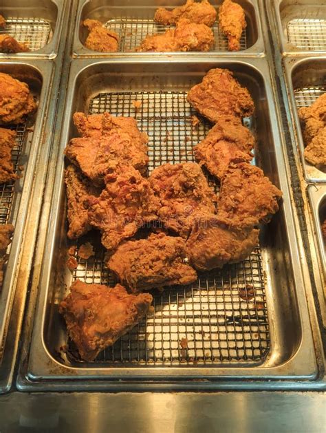 Take Out Fried Chicken In Metal Tray Under Heat Lamps Stock Image